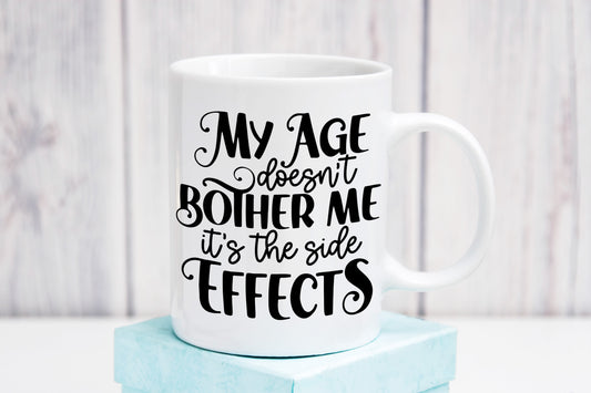 My age doesn't bother me it's the side effects 11oz Ceramic Mug, Hilarious